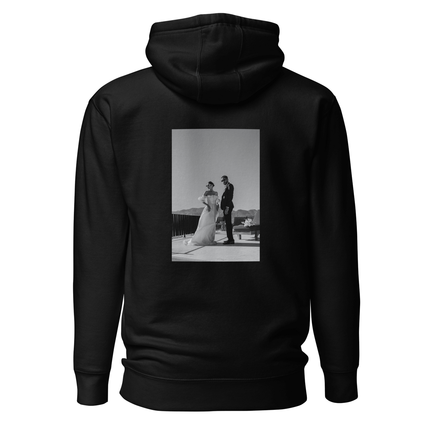 Black unisex hoodie showcasing a personalized picture on the back. The design allows for customization, adding a unique and personal touch to the minimalist style.